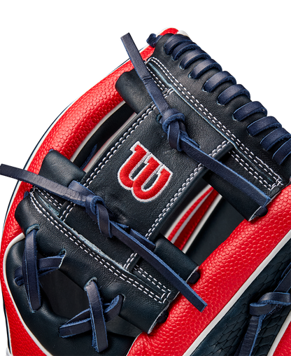Close-up of the Wilson A2K 1724SS 11.75" Baseball Glove (FALL 2024), showing Pro Stock Select leather, detailed stitching, laces, SuperSkin accents, and the iconic white W logo on the red and navy blue design.