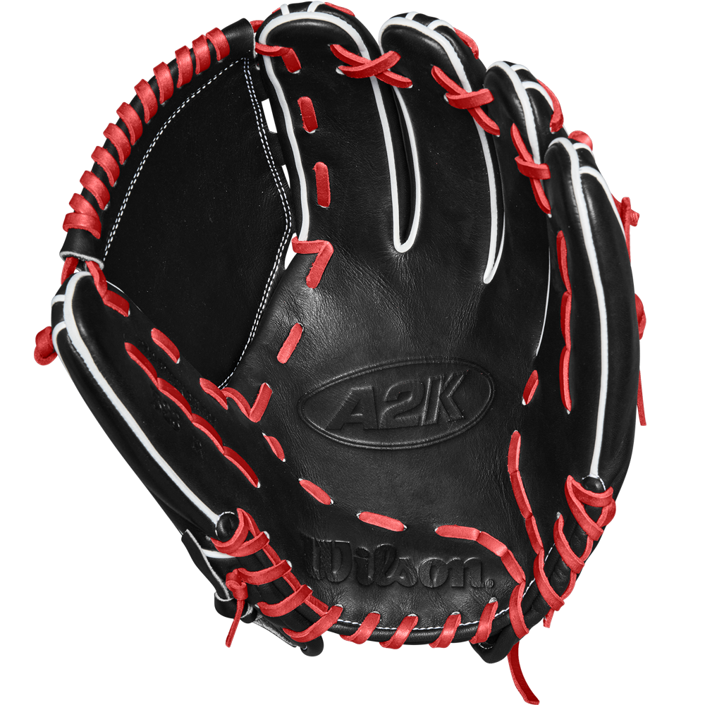 The Wilson A2K B23 12" Baseball Glove (FALL 2024: WBW10261812) by Wilson is shown open, highlighting its Pro Stock leather, black color, intricate stitching details, and striking red and white lacing.
