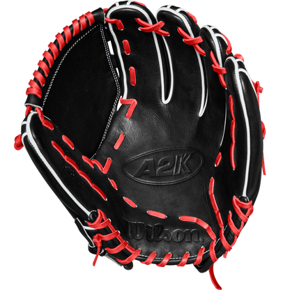 The Wilson A2K B23 12" Baseball Glove (FALL 2024: WBW10261812) by Wilson is shown open, highlighting its Pro Stock leather, black color, intricate stitching details, and striking red and white lacing.