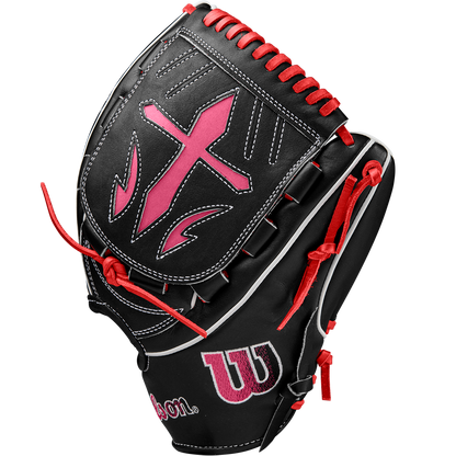 The Wilson A2K B23 12" Baseball Glove (FALL 2024) features black Pro Stock leather, red and pink accents, white stitching, a large pink cross on the back, red laces, and the Wilson logo.