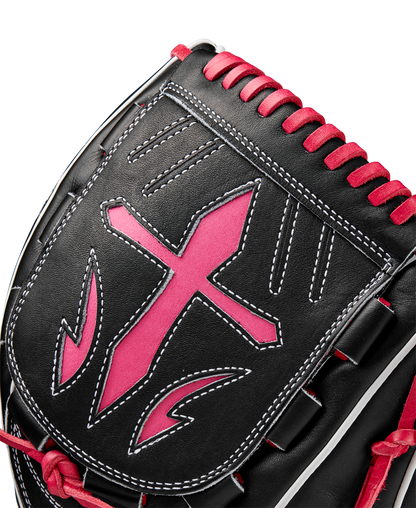Close-up of the Wilson A2K B23 12" Baseball Glove (FALL 2024), featuring Pro Stock leather in black with white stitching, a bold pink-edged cross design, and pink lacing along the top.