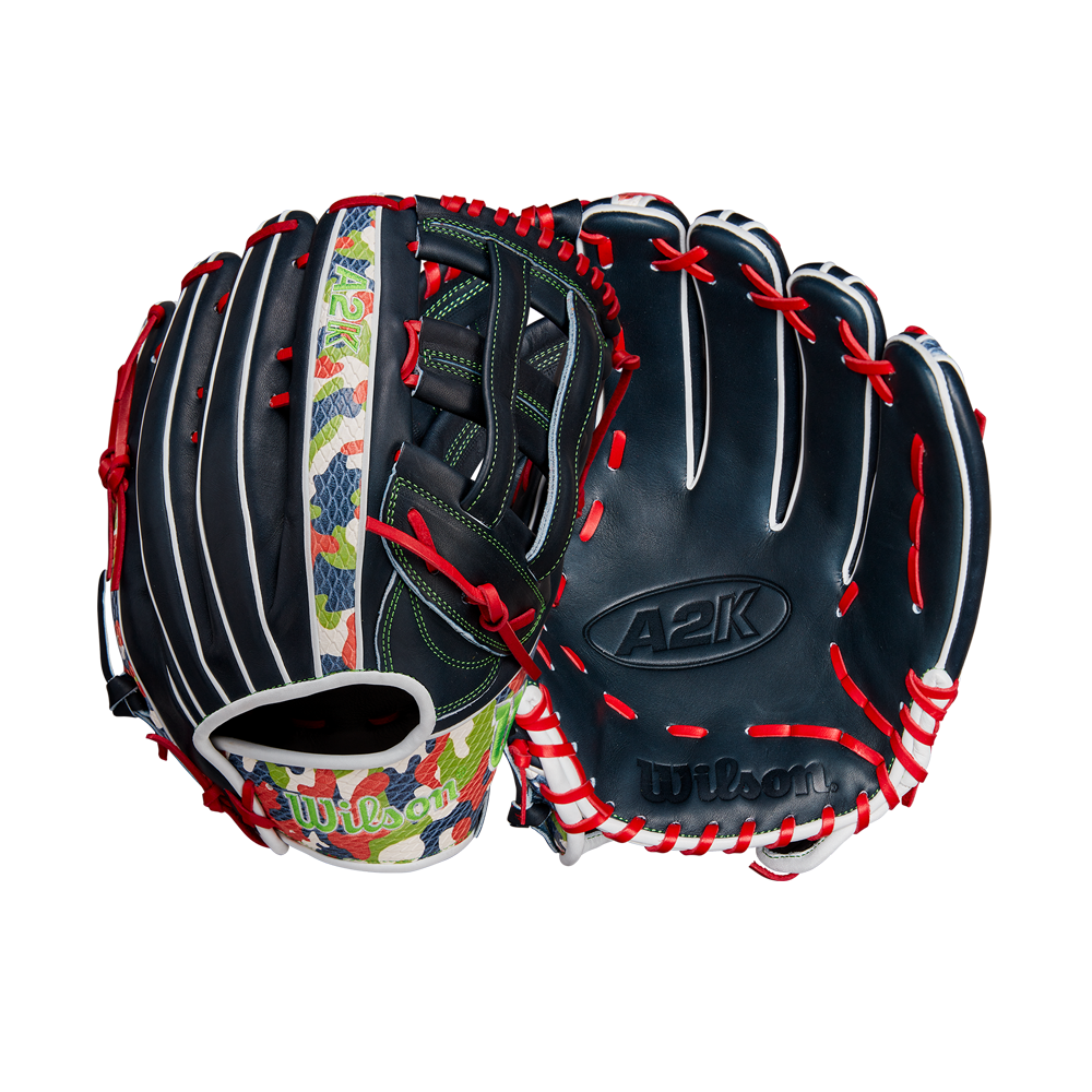 The Wilson A2K MH23 12.75" Michael Harris GM glove features navy blue Pro Stock Select leather, white/red laces, a colorful thumb strip, green stitching, and Wilson branding.