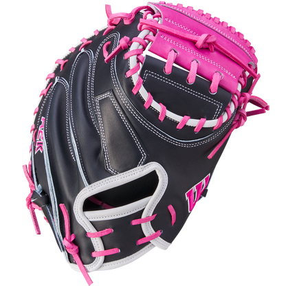 The Wilson A2K M23 33.5" Catcher's Mitt (WBW102622335) is black with pink laces and accents, white trim and stitching, crafted from Pro Stock Select leather, and shown on a white background.