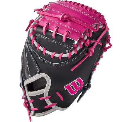 The Wilson A2K M23 33.5" Baseball Catcher's Mitt (FALL 2024: WBW102622335) features a black Pro Stock Select leather shell, pink and gray lacing, a pink W logo on the side, and contrasting pink and gray stitching throughout.