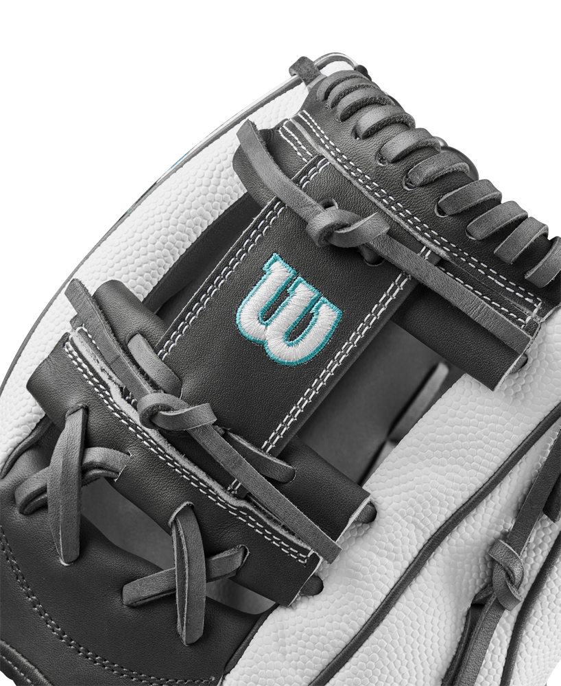 Close-up of the Wilson A2000 H75SS 11.75" Fastpitch Glove, showcasing black and white SuperSkin material, detailed stitching, laces, and a blue embroidered W logo on the leather.