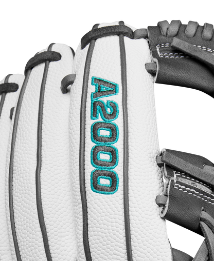 Close-up of the Wilson A2000 H75SS 11.75" Fastpitch Glove (WBW1026231175) in white with black and gray lacing, featuring SuperSkin material and blue-green A2000 embroidery on the finger.