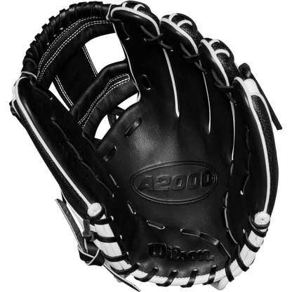 A Wilson A2000 H12SS 12" Fastpitch Glove (WBW10262412) in black with white laces and stitching is shown open, palm up, highlighting the Wilson branding and model name embossed on the leather.