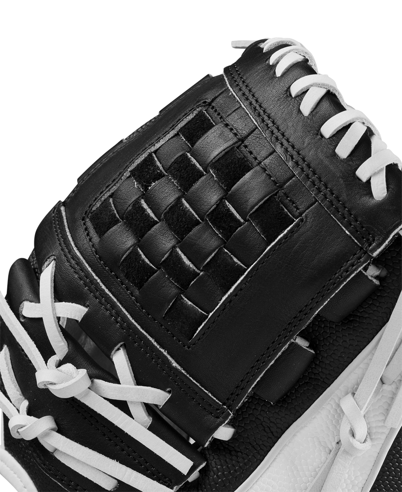 Close-up of the Wilson A2000 P12 12" Fastpitch Glove (WBW10267512) with woven webbing and white laces on its textured black and white leather surface.