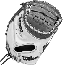 A close-up of the Wilson A2000 FPCM23 34" Fastpitch Catcher's Mitt (WBW10268134) in white and gray Pro Stock Leather, showing detailed stitching, lacing on the pocket and webbing, with the Wilson brand name clearly visible.