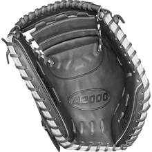 A close-up of the Wilson A2000 FPCM23 34" Fastpitch Catcher's Mitt (WBW10268134) in black and white Pro Stock Leather, featuring detailed stitching, lacing, and embossed branding.