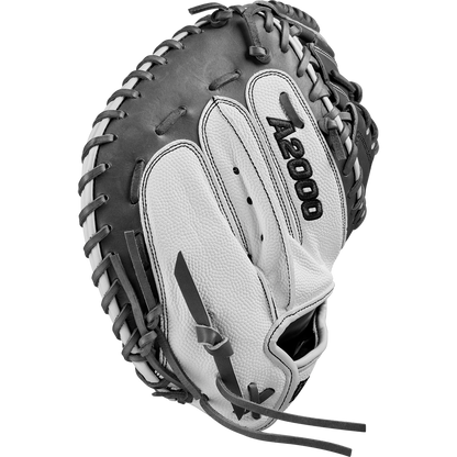 The Wilson A2000 FPCM23 34" Fastpitch Catcher's Mitt (WBW10268134) is a gray and black catcher's mitt crafted from durable Pro Stock Leather with detailed edge lacing and textured leather for long-lasting performance.