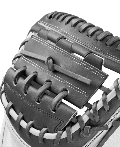 Close-up of the Wilson A2000 FPCM23 34" Fastpitch Catcher's Mitt (WBW10268134), highlighting its black and white Pro Stock Leather, detailed stitching, webbing, and laces.