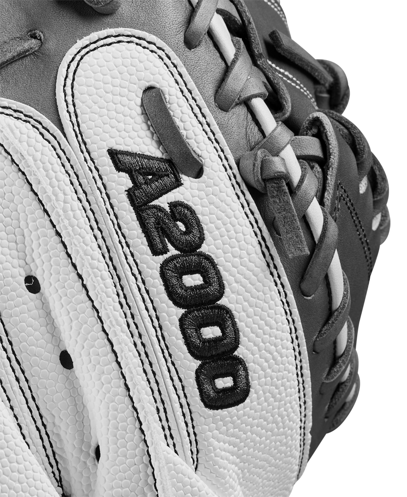 A close-up of the Wilson A2000 FPCM23 34" Fastpitch Catcher's Mitt (WBW10268134), crafted with Pro Stock Leather, highlights the exceptional quality and durability expected from a Wilson glove.