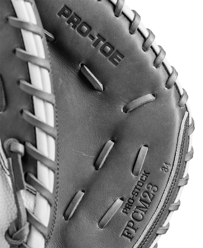 Close-up of a Wilson A2000 FPCM23 34" Fastpitch Catcher's Mitt (WBW10268134) in black and white, showing detailed stitching and "PRO-TOE" text, crafted from durable Pro Stock Leather by Wilson.