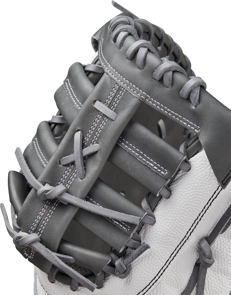 A close-up of the Wilson A2000 1620SS 12.5" Fastpitch First Base Mitt (WBW102682125), featuring gray and white Pro Stock leather, highlights detailed stitching and lacing on the webbing and thumb area.