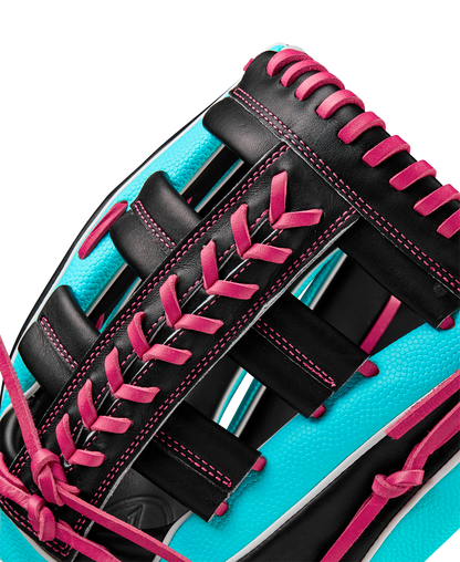 Close-up of the Wilson A2K 1810SS 12.75" Baseball Glove (Winter 2024: WBW1026881275) showing bright turquoise Pro Stock Select leather, black panels, and vivid pink laces accentuating the glove’s texture and stitching.
