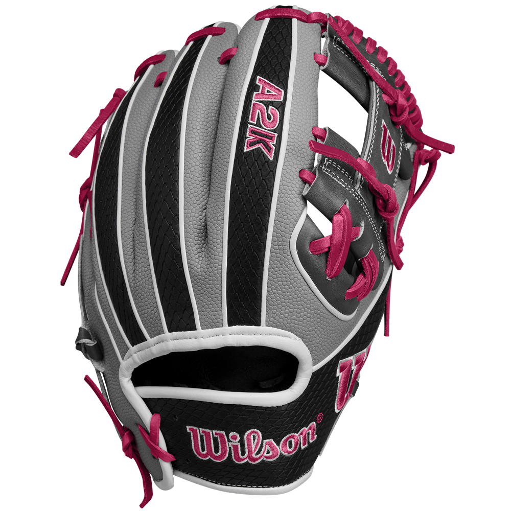 The Wilson A2K 1786SS 11.5" Baseball Glove (SPRING 2025) features a gray and black design with pink laces and stitching, Pro Stock Select leather, and the Wilson logo on the palm and thumb.