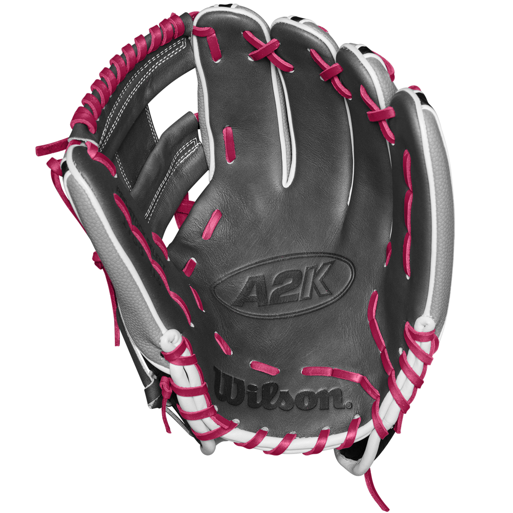 The Wilson A2K 1786SS 11.5" Baseball Glove - SPRING 2025 (WBW102690115) features a black design with white accents, bright pink laces, and durable SuperSkin and Pro Stock Select leather, shown palm up on a white background.