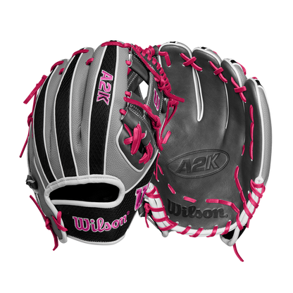 The Wilson A2K 1786SS 11.5" Baseball Glove (SPRING 2025) by Wilson is shown in black, gray, and white leather with bright pink laces and accents, displayed front and back against a plain white background.
