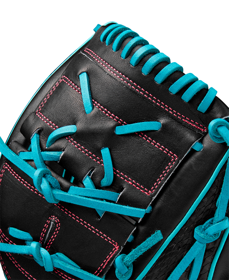 Close-up of the Wilson A2K B2 12" Baseball Glove (SPRING 2025: WBW10269212) with bright blue laces, pink stitching, and a Closed 2-Piece Web. Expert Wilson craftsmanship is highlighted against a plain white background.