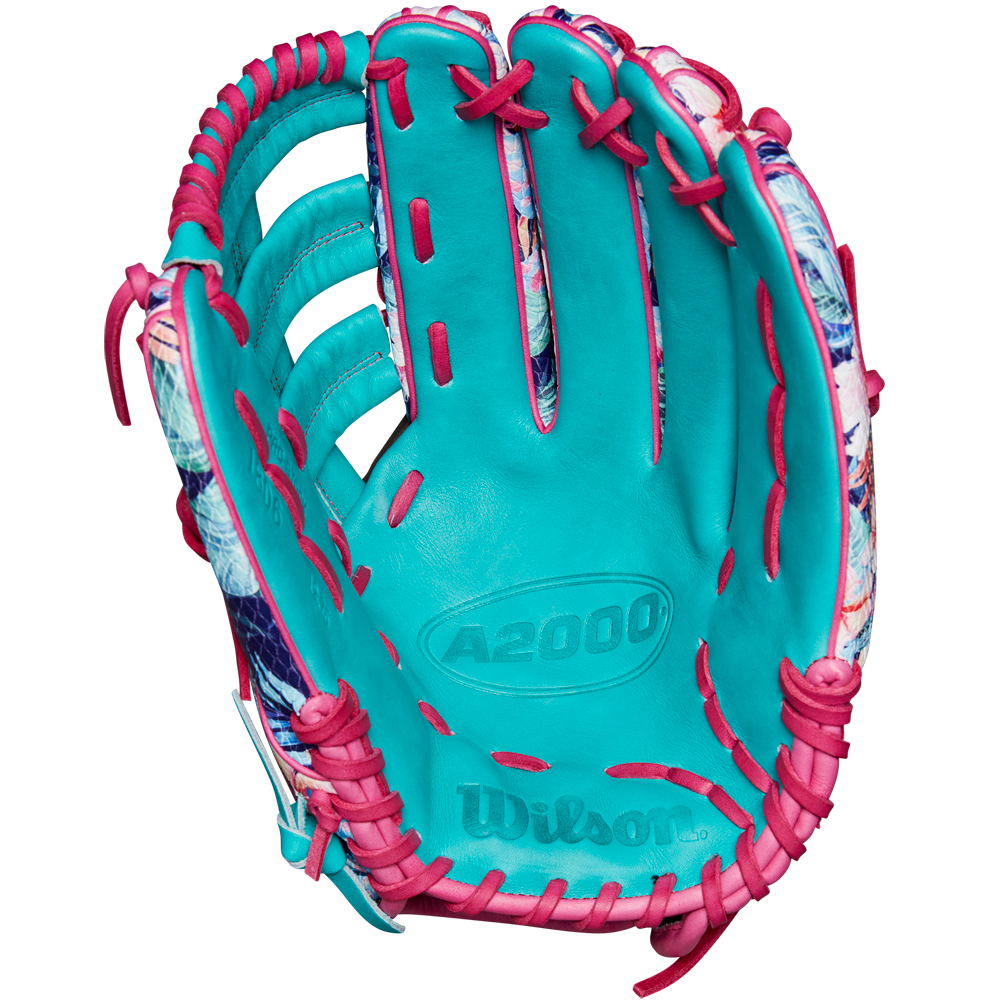 A turquoise Wilson A2000 RA56 12.75" Randy Arozarena GM Baseball Glove (SPRING 2025: WBW1026941275) with pink lacing and SuperSnakeSkin accents, shown palm up to highlight interior details and Wilson branding.