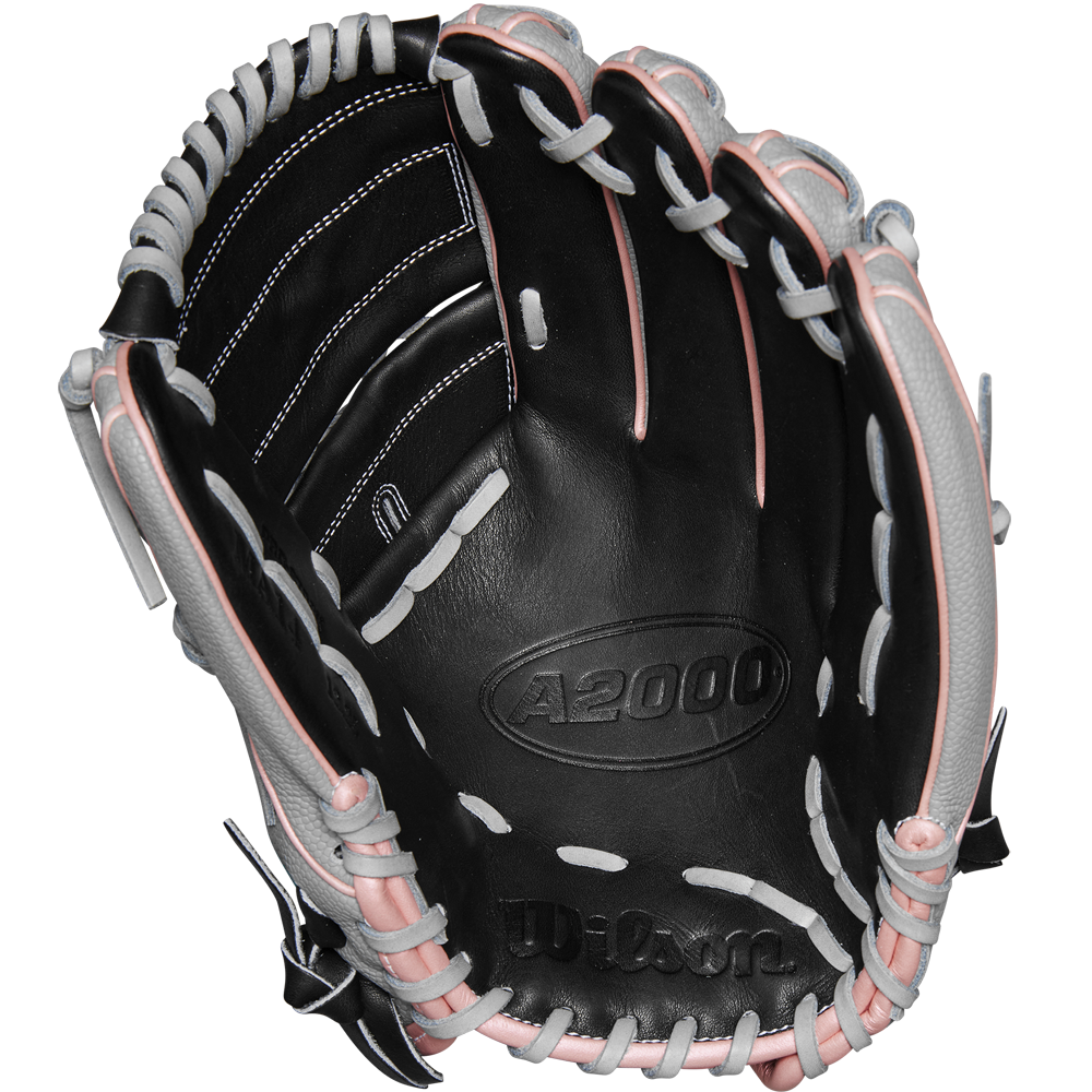 The Wilson A2000 MA14SS 12.25" Fastpitch Glove (WBW1027221225) features a black design with white and pink laces, crafted from Pro Stock leather and inspired by the Monica Abbott glove, shown open with visible palm and webbing.