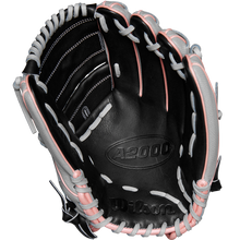 The Wilson A2000 MA14SS 12.25" Fastpitch Glove (WBW1027221225) features a black design with white and pink laces, crafted from Pro Stock leather and inspired by the Monica Abbott glove, shown open with visible palm and webbing.