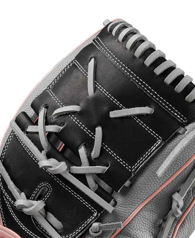 Close-up of the Wilson A2000 MA14SS 12.25" Fastpitch Glove (WBW1027221225) in black and gray leather with white stitching and pink accents, highlighting detailed lacing—perfect for fastpitch pitchers.