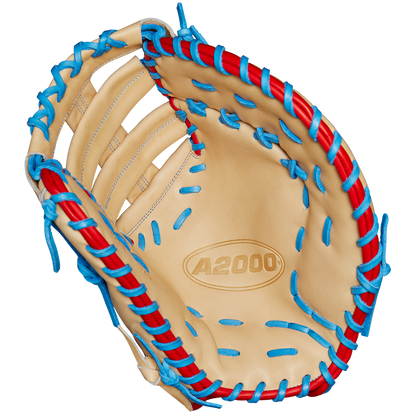The Wilson A2000 1677 12.5" First Base Mitt (Spring 2025, WBW102753125) features tan Pro Stock leather, blue and red laces, detailed stitching, an open web, and the A2000 logo in the palm.