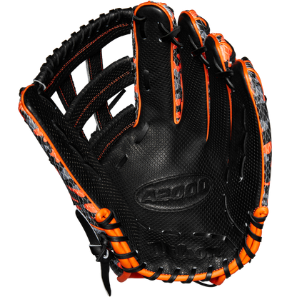 The Wilson A2000 SC1777SS 12.75" GOTM October 2024 baseball glove features a limited black design with orange accents, grey patterned details, embossed A5000 palm text, Pro Stock leather, and fine stitching. Model: WBW1027911275.