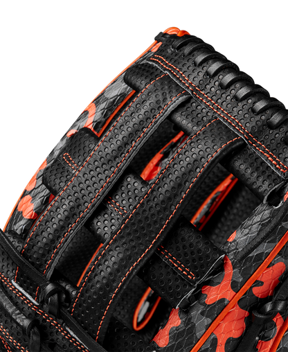 Close-up of the limited edition Wilson A2000 SC1777SS 12.75" Baseball Glove (GOTM Oct 2024), crafted from Pro Stock leather with black and orange camo, orange stitching, and detailed woven lacing. Model: WBW1027911275.