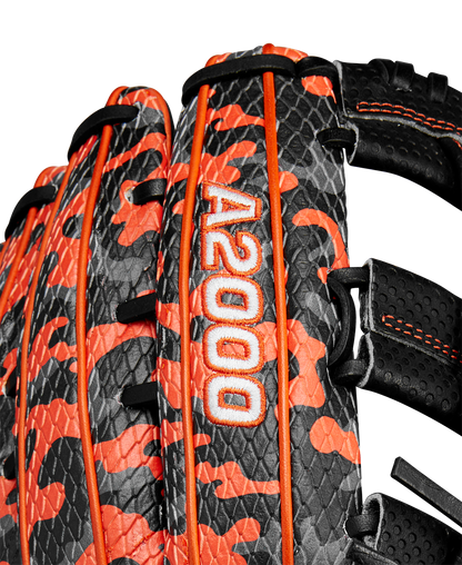 Close-up of the Wilson A2000 SC1777SS 12.75" GOTM October 2024 Baseball Glove featuring limited edition black Pro Stock leather, orange camouflage accents, white A2000 embroidery, orange stitching, and black lacing.