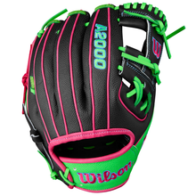 The Wilson A2000 1786SS 11.5" Baseball Glove (WBW103218115) features a black design with green laces and stitching, pink trim, blue logos, and durable SuperSkin on the wrist strap and back.