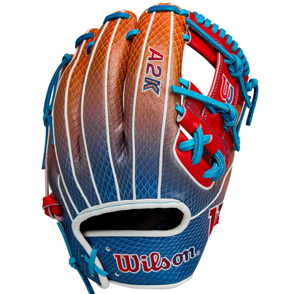 The Wilson A2K 1786SS 11.5" Baseball Glove (WBW103290115) features a gradient orange, brown, and blue design with blue laces, red accents, and durable SuperSnakeSkin construction. Summer 2025 release by Wilson.