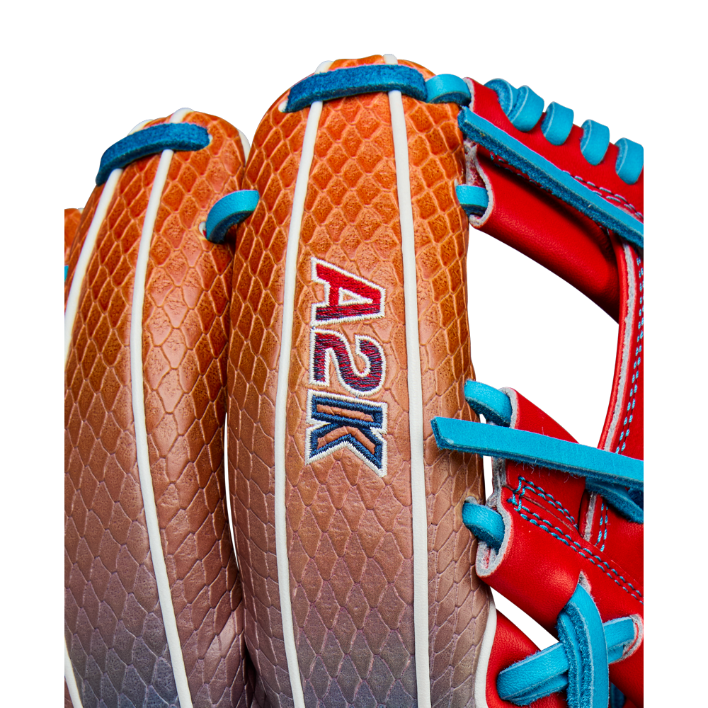 Close-up of the Wilson A2K 1786SS 11.5" Baseball Glove (WBW103290115) with a brown and tan textured design, SuperSnakeSkin accents, and blue and red laces, released for Summer 2025.