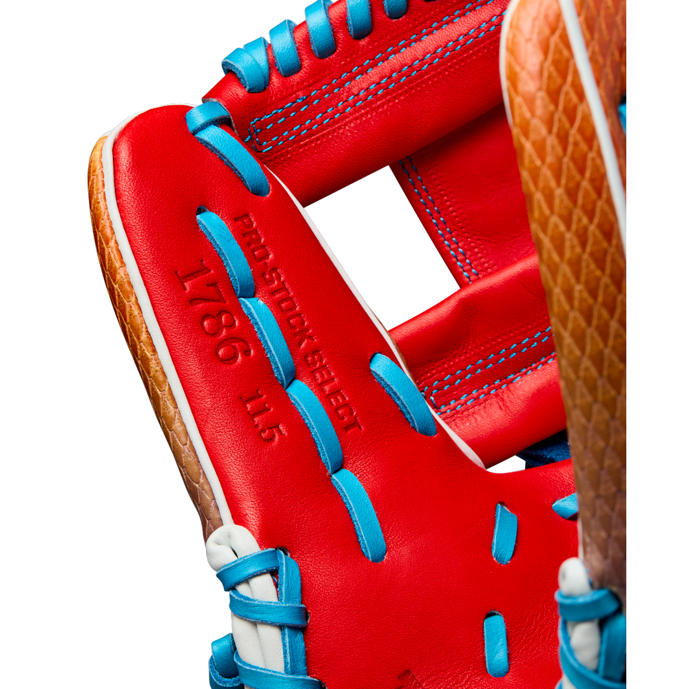Close-up of a Wilson A2K 1786SS 11.5" Baseball Glove (WBW103290115) with blue laces, brown accents, red SuperSnakeSkin leather, and PRO STOCK SELECT 1786 11.5 stamped on its surface.
