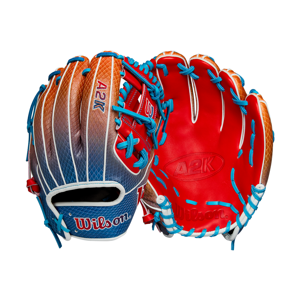 Two Wilson A2K 1786SS 11.5" Baseball Gloves (Summer 2025: WBW103290115) are shown, one palm-up and one back-up, with bold red, orange, and blue colors, blue laces, white accents, and SuperSnakeSkin. Brand: Wilson.