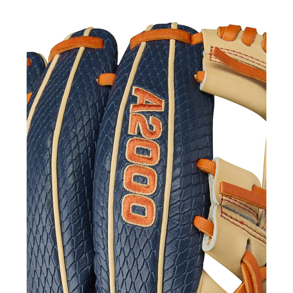 Close-up of the Wilson A2000 JA27 11.5" Jose Altuve GM Baseball Glove, featuring Pro Stock leather, an orange A2000 logo, orange and beige laces, and blue sections with a textured Jose Altuve-inspired pattern. Model: WBW103295115.