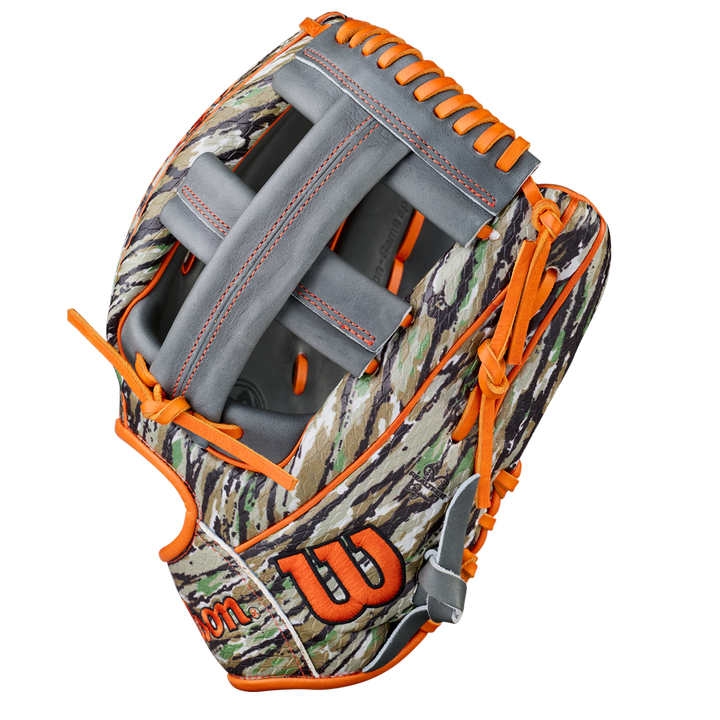 The Wilson A2000 GH2 11.75" Gunnar Henderson GM Baseball Glove (WBW1034511175) features a camouflage design, gray webbing, bright orange laces, plus an orange W logo and Wilson branding on the lower part of this infield glove.