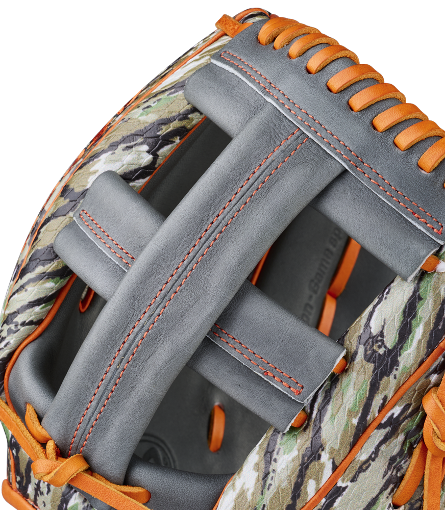 Close-up of a Wilson A2000 GH2 11.75" Gunnar Henderson GM Baseball Glove (WBW1034511175) with camouflage-patterned leather, gray palm, and orange laces. The partially open glove reveals part of the interior.