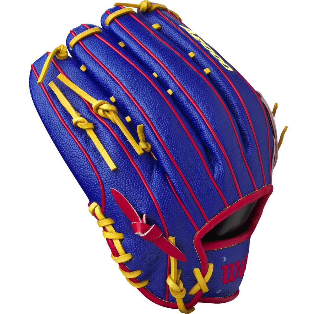 The Wilson A2000 1799SS 12.75" Pete Crow-Armstrong GM Baseball Glove (GOTM January 2025, WBW1034771275) features blue leather, red accents, yellow laces, embossed stitching, and the Wilson logo near the thumb.