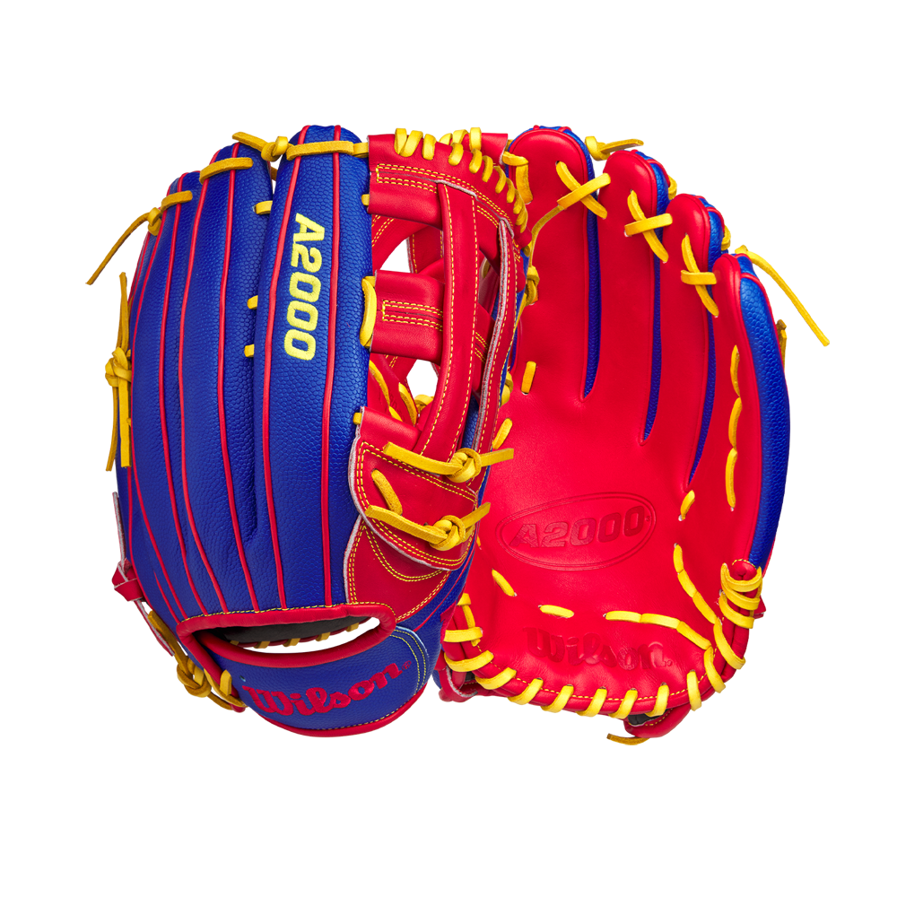 Two Wilson A2000 1799SS 12.75" Pete Crow-Armstrong GM Baseball Gloves (GOTM January 2025) with blue exteriors, red interiors, and yellow laces are displayed side by side against a white background.