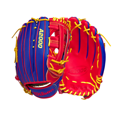 Two Wilson A2000 1799SS 12.75" Pete Crow-Armstrong GM Baseball Gloves (GOTM January 2025) with blue exteriors, red interiors, and yellow laces are displayed side by side against a white background.