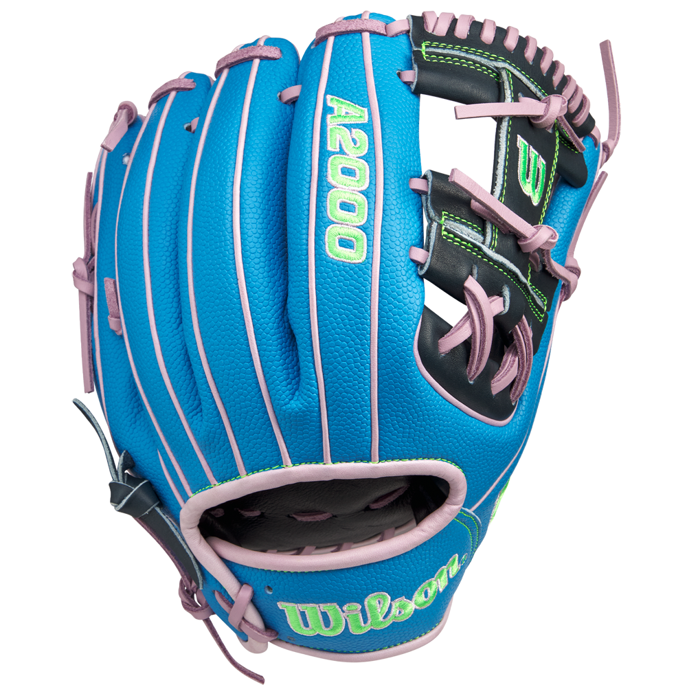 The Wilson A2000 1786SS 11.5" GOTM March 2025 glove (WBW103479115) features blue SuperSkin, pink lacing and trim, a black palm area, and green embroidered lettering. Shown on a white background. Brand: Wilson.