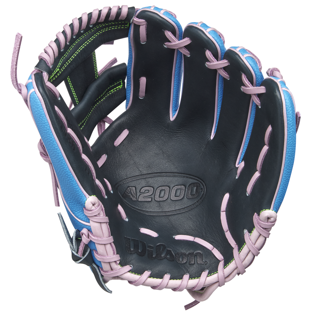 The Wilson A2000 1786SS 11.5" Baseball Glove (GOTM March 2025, WBW103479115) features durable Pro Stock leather, a black palm, blue shell, pink laces, green stitching accents, and an embossed Wilson logo inside.