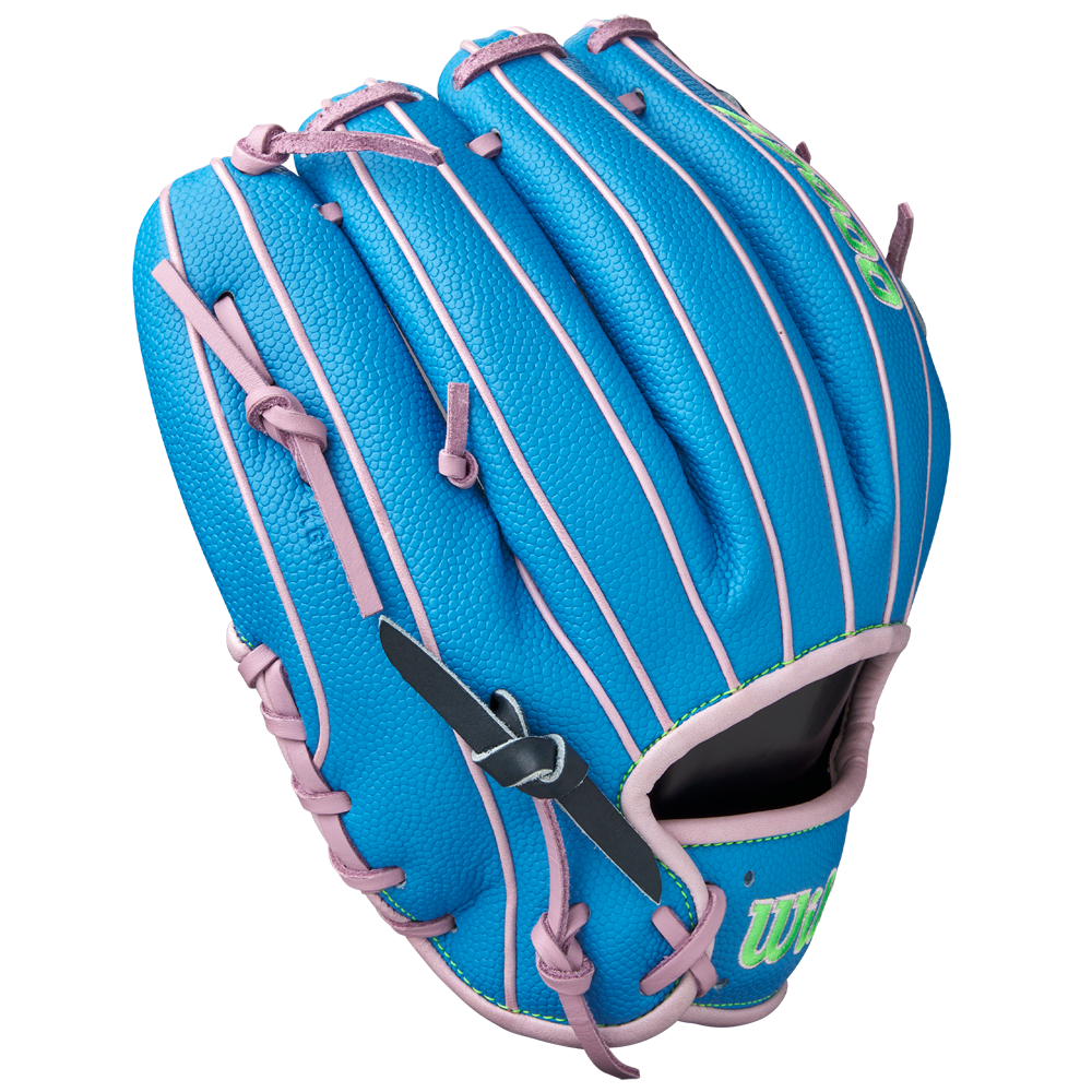 The Wilson A2000 1786SS 11.5" Baseball Glove (GOTM March 2025, WBW103479115) features blue Pro Stock leather with pink laces/trim, a black strap, green thumb lettering, and is displayed on a plain white background.