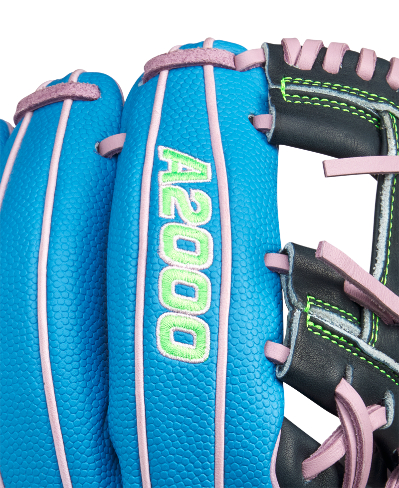 Close-up of the Wilson A2000 1786SS 11.5" Baseball Glove (GOTM March 2025) featuring blue Pro Stock leather, pink laces, green stitching, and "A2000" embroidered in green and white on the finger.