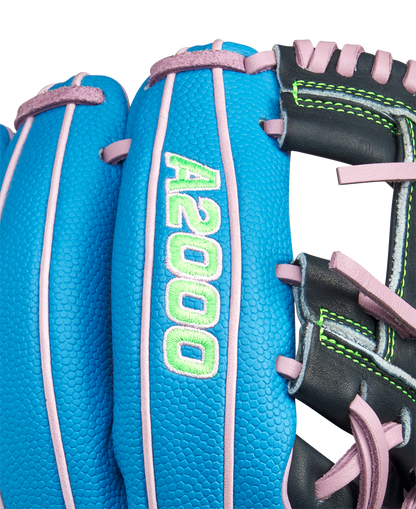 Close-up of the Wilson A2000 1786SS 11.5" Baseball Glove (GOTM March 2025) featuring blue Pro Stock leather, pink laces, green stitching, and "A2000" embroidered in green and white on the finger.