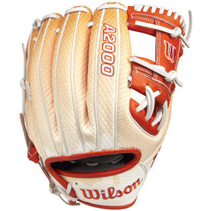 The Wilson A2000 1975SS 11.75" Baseball Glove (GOTM June 2025: WBW1034811175) by Wilson features tan and white Pro Stock leather, red accents, white lacing, and embroidered thumb branding, shown from the top side.