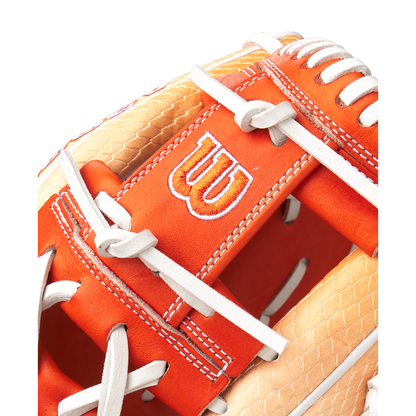 Close-up of the Wilson A2000 1975SS 11.75" Baseball Glove (GOTM June 2025, WBW1034811175) in orange and tan Pro Stock leather, featuring white stitching, laces, and the signature embroidered white W logo.
